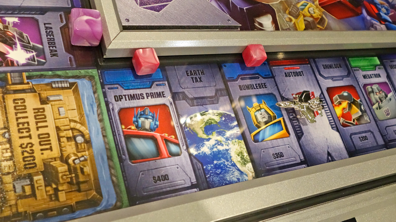 Illustration for article titled Transformers Monopoly Is a Work of Art You Can Actually Hang on a Wall